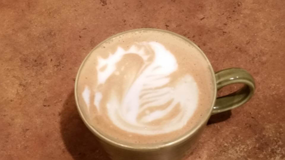 coffee with a dragon in the foam